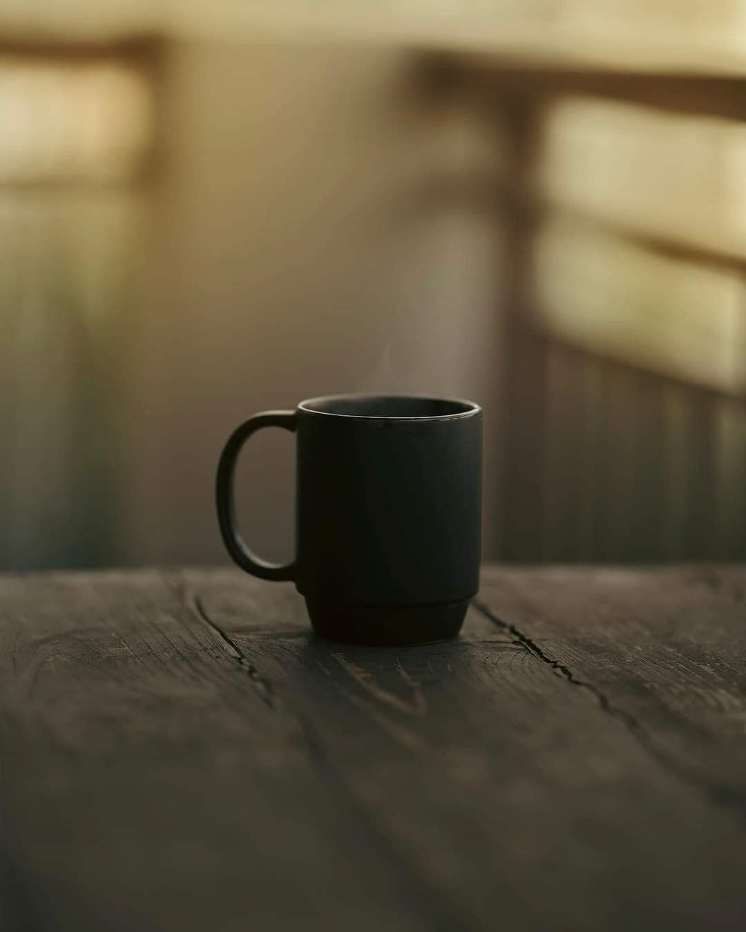 A cup of coffee on a wooden table